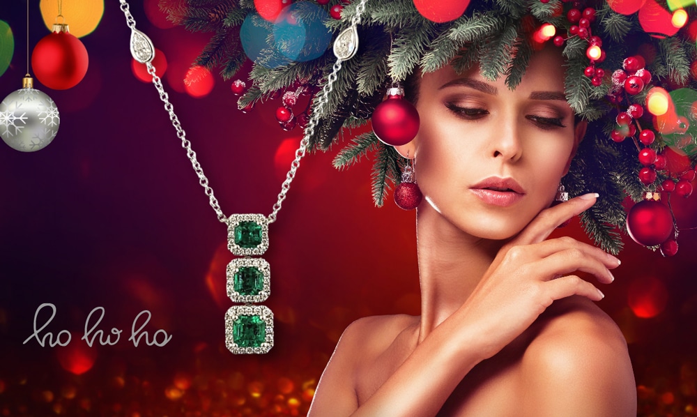best jewelry gifts for christmas featured image with woman in holiday decorations wearing fine jewelry